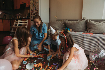 mother with three children celebrates her birthday at home