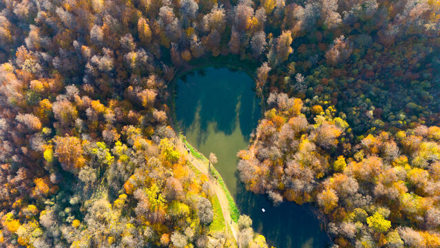 Colorful view of the autumn forest with lake. Parz Lake in Tavush, Armenia. Taken with a drone