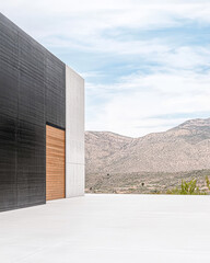 Modern architectural design contrasts natural landscape in a minimalist setting