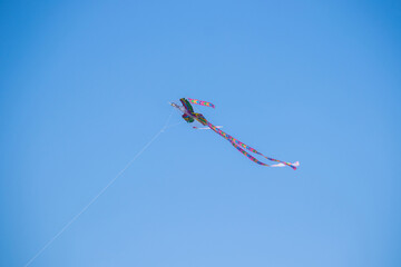 The dance of a eagle kite across the blue sky. Kite flying is a traditional Korean folk game...