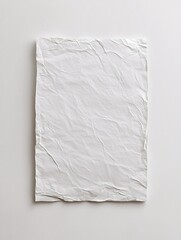 Obraz premium A sophisticated paper mockup presents a blank textured canvas on a pristine background, perfect for showcasing branding or artwork with ease.