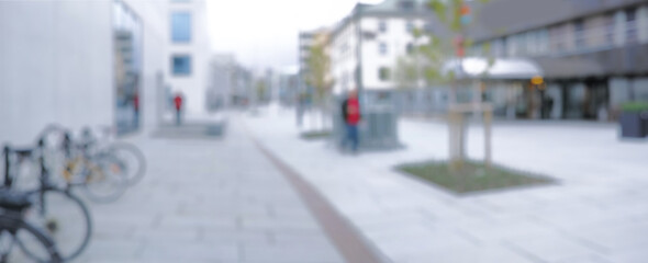 Street, architecture and city with blurry outdoor for travel vacation, urban explore and buildings. Businesses, cbd sidewalk and road for infrastructure journey, adventure trip and holiday commute