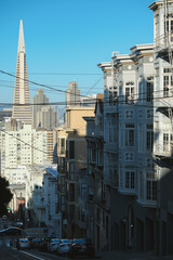 Picturesque Victorian house architecture with modern futuristic downtown San Francisco skyline...