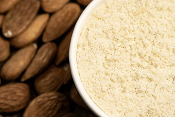 raw almond nuts and almound flour close up