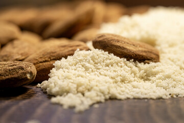 raw almond nuts and almound flour close up