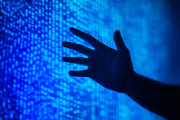 Digital hand reaching on screen   