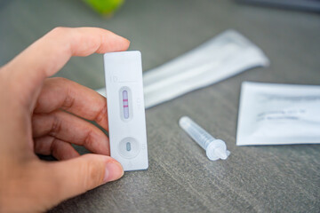 Rapid Antigen Test kit with with Positive result during swab COVID-19 testing. Coronavirus Self nasal or Home test, Autumn exacerbation of viruses