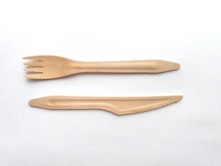 Eco friendly compostable utensils made from sustainable wood on white background