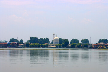 Distant Building on the Lake Shore with Trees and Calm Water, Dal lake Kashmir