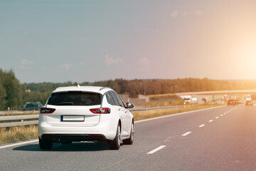 White combi car driving along the highway