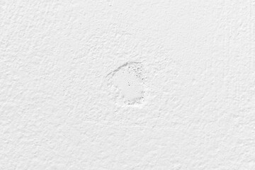 White concrete wall texture background. Uneven render stucco white painted concrete wall texture background. Rough and grunge wall.	