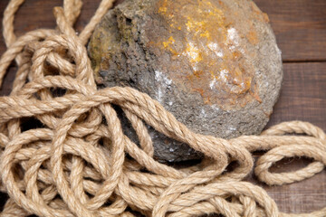 A rope is tangled around a rock