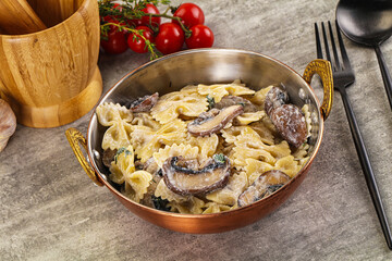 Italian cuisine - farfalle with mushrooms