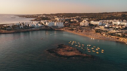 Aerial view of coastal town at sunset.