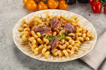 Italian pasta cellentani with anchovy