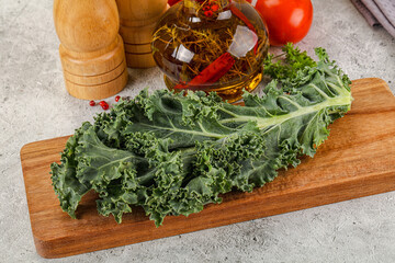 Green Kale cabbage leaves ocer board