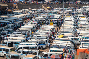 Spacious parking lot that is filled with numerous cars and people, Kigali Rwanda