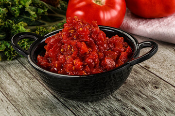 Diced ripe tomato with sauce