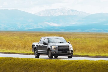 Sturdy pickup truck on a misty rural road