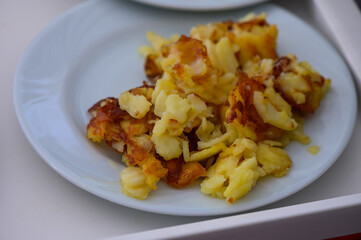 A delicious plate of crispy potato pancake bites served at a cozy gathering during a sunny afternoon