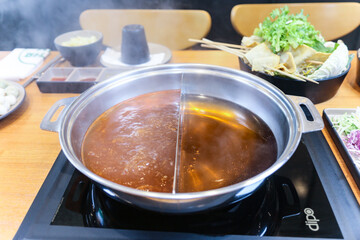 Korean style Shabu Shabu. Two types of broth. Mild and spicy taste