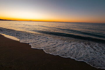 beautiful sunrise on the sea with waves