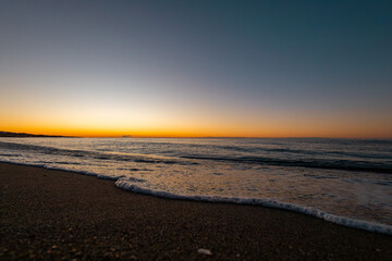 beautiful sunrise on the sea with waves