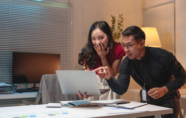 Excited team of Asian businessmen celebrate victory together in office Group of professionals, supervisors and subordinates who are happy and delighted with teamwork concept.