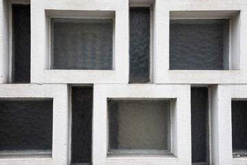 windows on a brick wall, abstract and geometric wall with white stone frames and windows