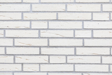 Obraz premium Beautiful white brick wall, vertical format, bright stone wall
