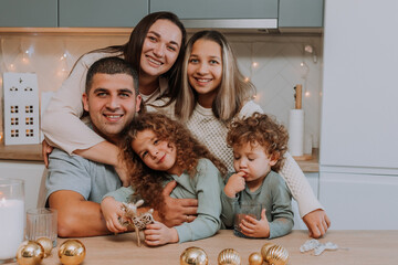 Fototapeta premium happy large family has breakfast in the kitchen on Christmas Day