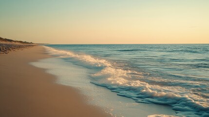 Fototapeta premium Tranquil Beach at Sunset with Gentle Waves