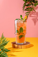 Summer style for displaying cocktails for bar menu on yellow and pink background with flowers.