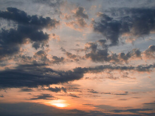 Gorgeous sunset with beautiful colors, clouds and silhouettes, at the end of a warm summer day.