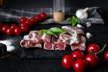 Fresh raw pork ribs. With spices. on a wooden background