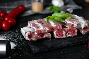 Fresh raw pork ribs. With spices. on a wooden background
