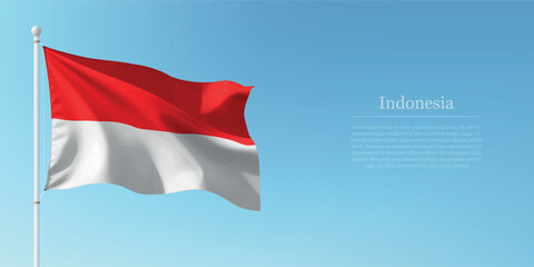 Waving Flag of Indonesia Against Clear Blue Sky Copyspace