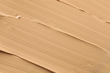 Fototapeta premium Texture of liquid foundation. Makeup base, BB cream smear background