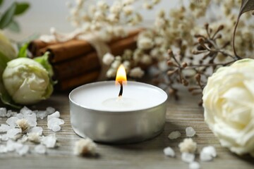 Aromamic candle burning on the table