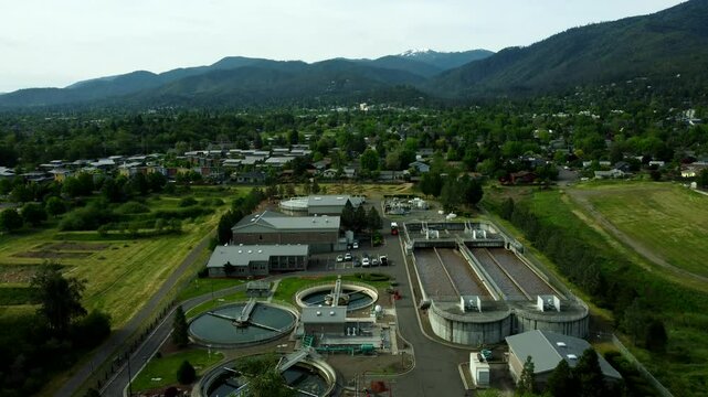 USA, OR, Ashland, WWTP, 45426 - Wastewater Treatment Plant in the North of Ashland. Camera is stationary looking South with downtown and Mt Ashland in the distance.