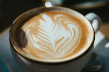 perfectly crafter cup of coffee on the table, flat white