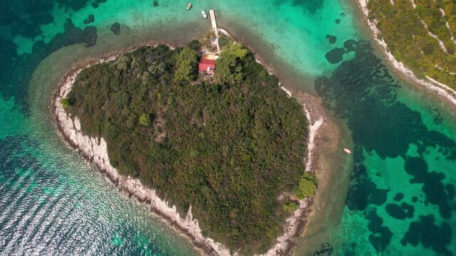 Bird's Eye View Of Uvala Otočić Mala Kneža In Rači&scaron;će, Croatia - Drone Shot