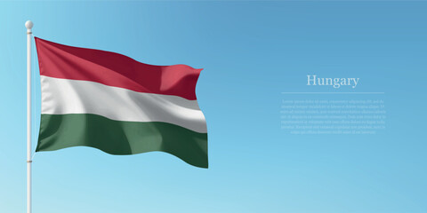 Waving Flag of Hungary Against Clear Blue Sky Copyspace