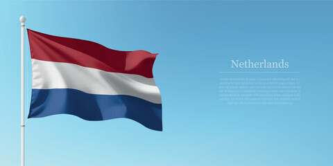 Waving Flag of Netherlands Against Clear Blue Sky Copyspace