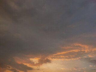 Naklejka premium Dramatic sunset or sunrise sky on twilight with Blue, Purple, black, grey, Pink and Orange sunlight over city