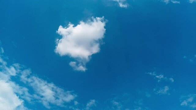 4k time lapse of blue sky with stratocumulus clouds on a sunny day. Movement of blue sky and clouds in fast motion.