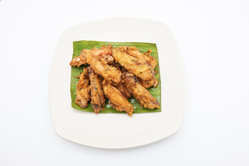 Fried chicken on white plate with white background, asia food, unhealthy food