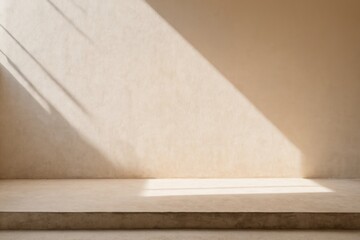 Sunlight illuminates a minimalist beige wall and concrete platform