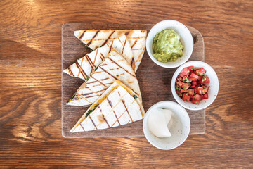 Maxican chicken quesadillas with strawberry on the wooden table