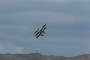 Seaplane performs aerobatics over waters of Gelendzhik Bay. Close-up. Seaplane U-2 or Po-2 (NATO codification: "Mule"). Hydroaviasalon - 2014.  Retro. Gelendzhik, Russia, September 4, 2014